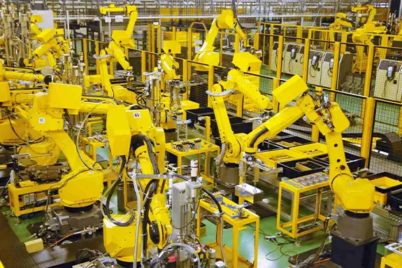 Multiple robots working together in a manufacturing plant.