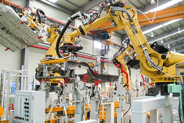 Industrial robot arms automating a production line